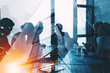 Leinwandbild Motiv Silhouette of business people work together in office. Concept of teamwork and partnership. double exposure with light effects