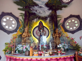 Statue of the Buddha god, Sacrifice oblation, traditional offerings for Gods in the Buddhist temple Brahma Vihara Indonesia. Bali Architecture, Ancient design. Travel concept.