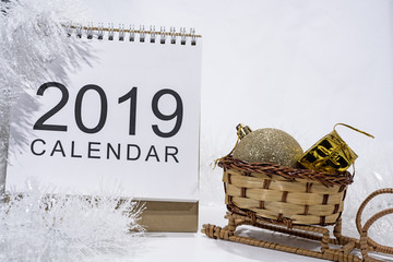 Wall Mural - Christmas decoration on white background. Table paper Calendar of Year 2019