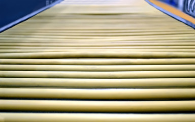 Wall Mural - yellow industrial conveyor, roll line production diversity