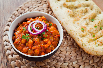 Wall Mural - Chickpea Vegetarian Curry  -  Chana Masala with Naan Bread.