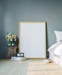 © bestpixels - Cozy bedroom with empty poster frame. Frame mockup in interior.