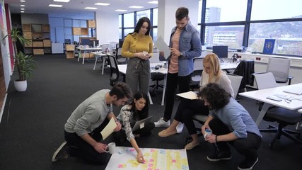 Wall Mural - Startup business people group discussing about their project. Tech office, tech company, tech startup, tech team.