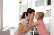© New Africa - Young beautiful woman and her daughter having fun in kitchen