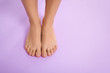 Woman with beautiful feet on color background, top view with space for text. Spa treatment