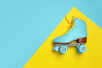 Wall Mural - stylish quad roller skate on color background, top view