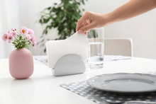 Woman Taking Paper Tissue From Ceramic Napkin Holder On Served Table