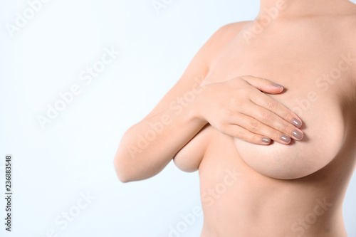 Fotomural Woman covering her breast and space for text on white background, closeup