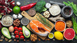 Healthy food clean eating selection: fish, fruit, nuts, vegetable, seeds, superfood, cereals, leaf vegetable on black concrete background. Flat lay