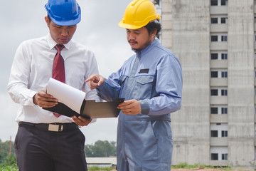 Building consultant. engineer and contractor discussing material specification from client in construction site area.