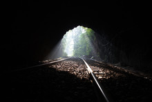 Railway Tracks Leading Out Of An Unlined Tunnel 5664