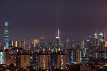 Night view of downtown Kuala Lumpur, a capital of Malaysia. Its modern skyline is dominated by the 451m-tall Petronas Twin Towers.