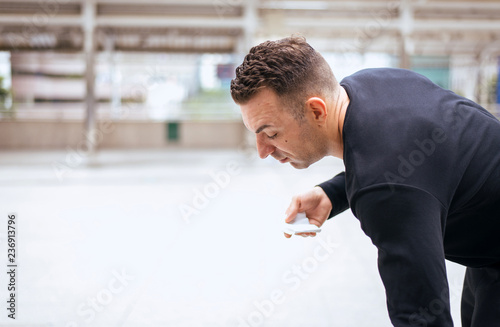 Fotografia, Obraz Drunk man standing on street after drinking alcohol in party at night