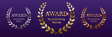 Golden, Silver And Bronze Award Signs With Laurel Wreath Isolated On Purple Background. Vector Award Design Templates.