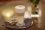 Fototapeta Kwiaty - Glass cup of coffee latte
