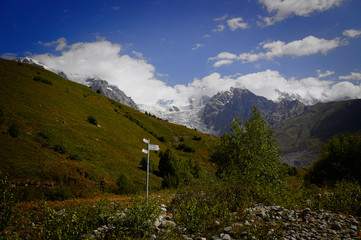 Wall Mural - Fantastic glacier mountains in the beautiful cumulus