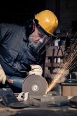 Wall Mural - man with grinder in action