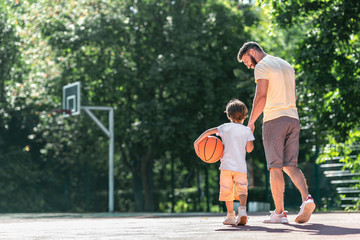 Young family on the basketball court