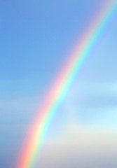 Bright rainbow in the blue sky