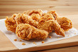 © fiermanmuch - crispy coated batter southern style fried chicken in a wooden table