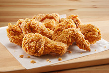 Crispy Coated Batter Southern Style Fried Chicken In A Wooden Table