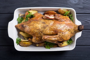 Wall Mural - Homemade baked duck with potatoes and apple . Christmas food