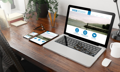 Wall Mural - devices web design on wooden desktop