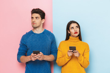 Wall Mural - Cheerful young couple standing