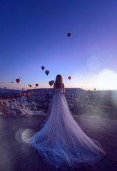 Wall Mural - Wedding in Cappadocia G?reme with a young married couple on the background of balloons.