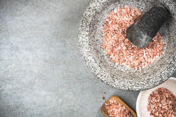 Wall Mural - Himalayan pink salt seed in granite mortar or pestle