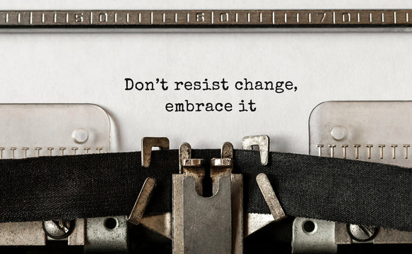 Text Do not resist change embrace it typed on retro typewriter