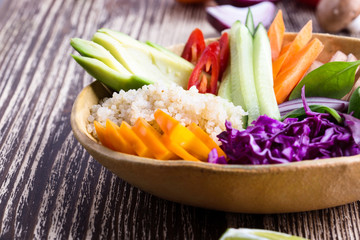 Wall Mural - Quinoa veggie bowl with colorful fresh vegetables and fruits