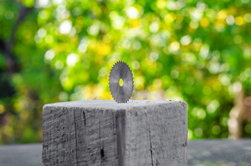 Poster - small circular saw in a wooden bar. Cutting tool for joiner