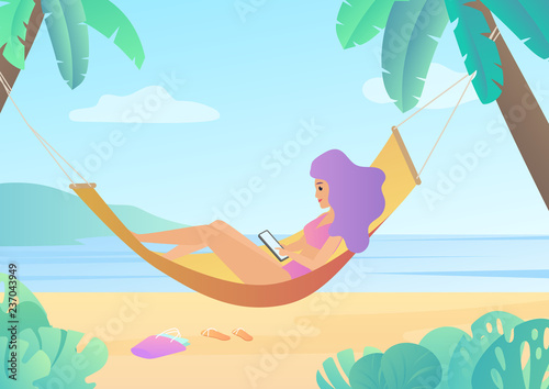 Photographie Girl in swimsuit in hammock between palm trees using smartphone and relaxing on beach