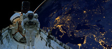Astronaut Spacewalk At Night From The Dark Side Of The Earth Planet. Elements Of This Image Furnished By NASA D
