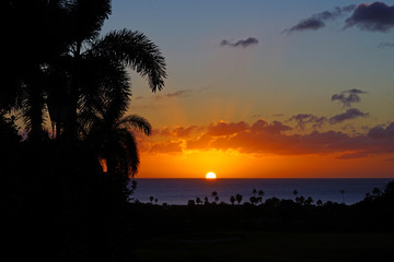 Wall Mural - Colorful sunset over the Caribbean Sea in Nevis, St Kitts and Nevis