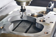 grinding or polishing metal detail on CNC machine.