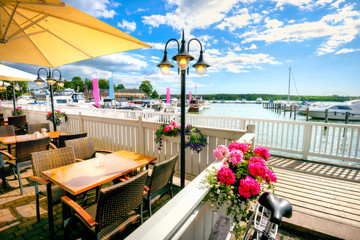 Seafront with cafe and marina in Naantali town at sunny summer day. Finland