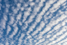 Cirrocumulus Clouds Against Blue Sky Background Pattern