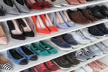 Shelving Unit With Different Shoes. Element Of Dressing Room Interior