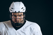 © alfa27 - Head and shoulder portrait of confident brave hockey player in white uniform with protective helmet looking at camera, being sure in his team s victory.