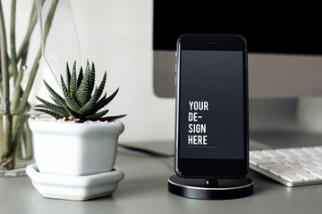 mockup of a mobile phone on a stand