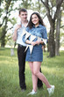 © soleg - young couple posing with flags in the forest, summer nature, romantic feelings
