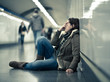 © SB Arts Media - Young depressed woman crying on the ground on subway underground