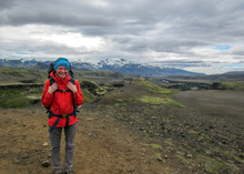 Young And Happy Experienced Hiker Girl With Heavy Backpack Enjoying The View On Laugavegur Hiking Trail From Thorsmork To Landmannalaugar, Iceland