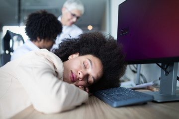 Wall Mural - Portrait of an exhausted business woman sleeping at work