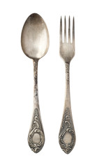 Vintage metal antique spoon and fork isolated on a white background. Retro silverware.