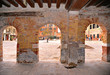 View on Venice Jewish Ghetto main square through three ancient arched doors made of red bricks. Italy