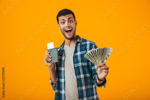 Fotografía Excited young man wearing plaid shirt standing