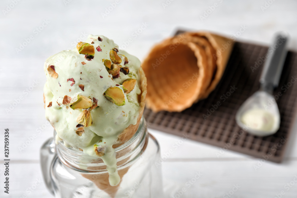 Waffle cone with delicious ice cream in jar